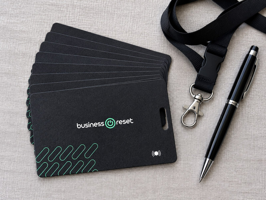 Stack of Business Reset branded tracking cards ready for an event