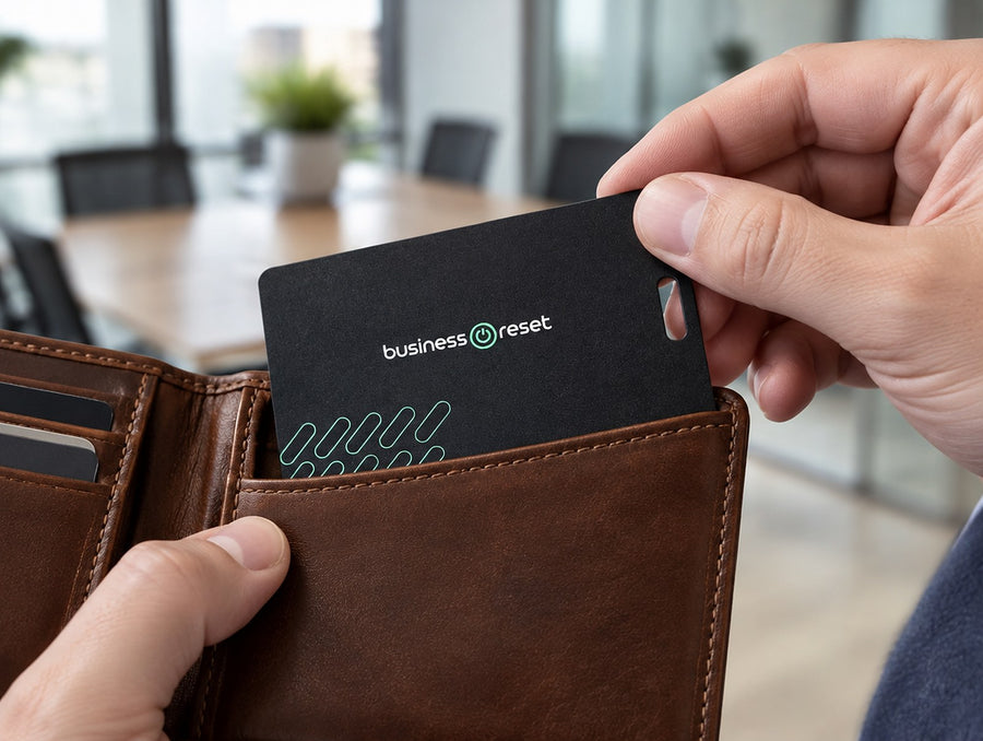 Business Reset branded tracking card going into a leather wallet